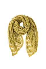 Elegant cashmere scarf with intricate lace pattern in a soft mustard hue, adding luxury to any outfit.