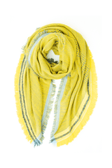Handcrafted cashmere scarf with macro pattern, fringes, and contrasting trim in vibrant yellow shades.