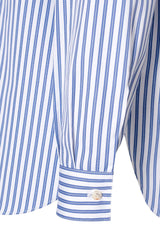Close-up of a striped blue and white shirt sleeve featuring a classic Italian collar and buttoned cuff.