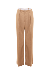 Ample wool pants in camel color with a contrasting striped cotton waistband, showcasing a sophisticated and contemporary style.