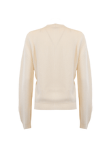 Back view of a white cashmere cardigan with ribbed texture and long sleeves.