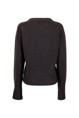 Back view of a loose-fit cashmere crewneck sweater in dark gray, showcasing ribbed cuffs and hem.