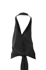 Elegant black cashmere gilet with tie detail and open back design, showcasing refined femininity.