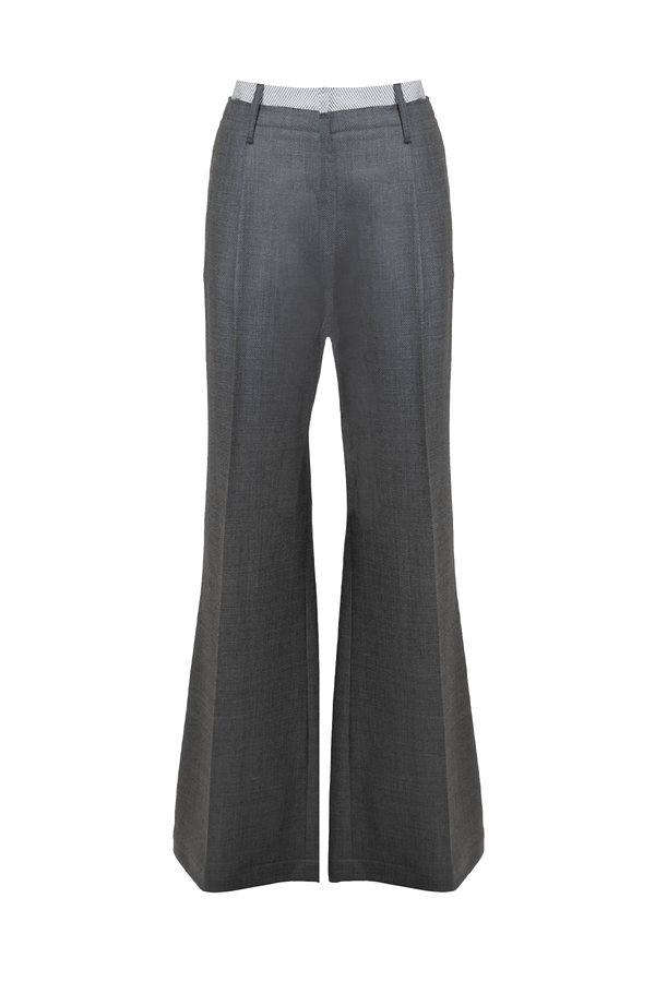 Pantalone ampio in lana grigia con cintura in cotone rigato, elegante e sofisticato per uno stile contemporaneo.