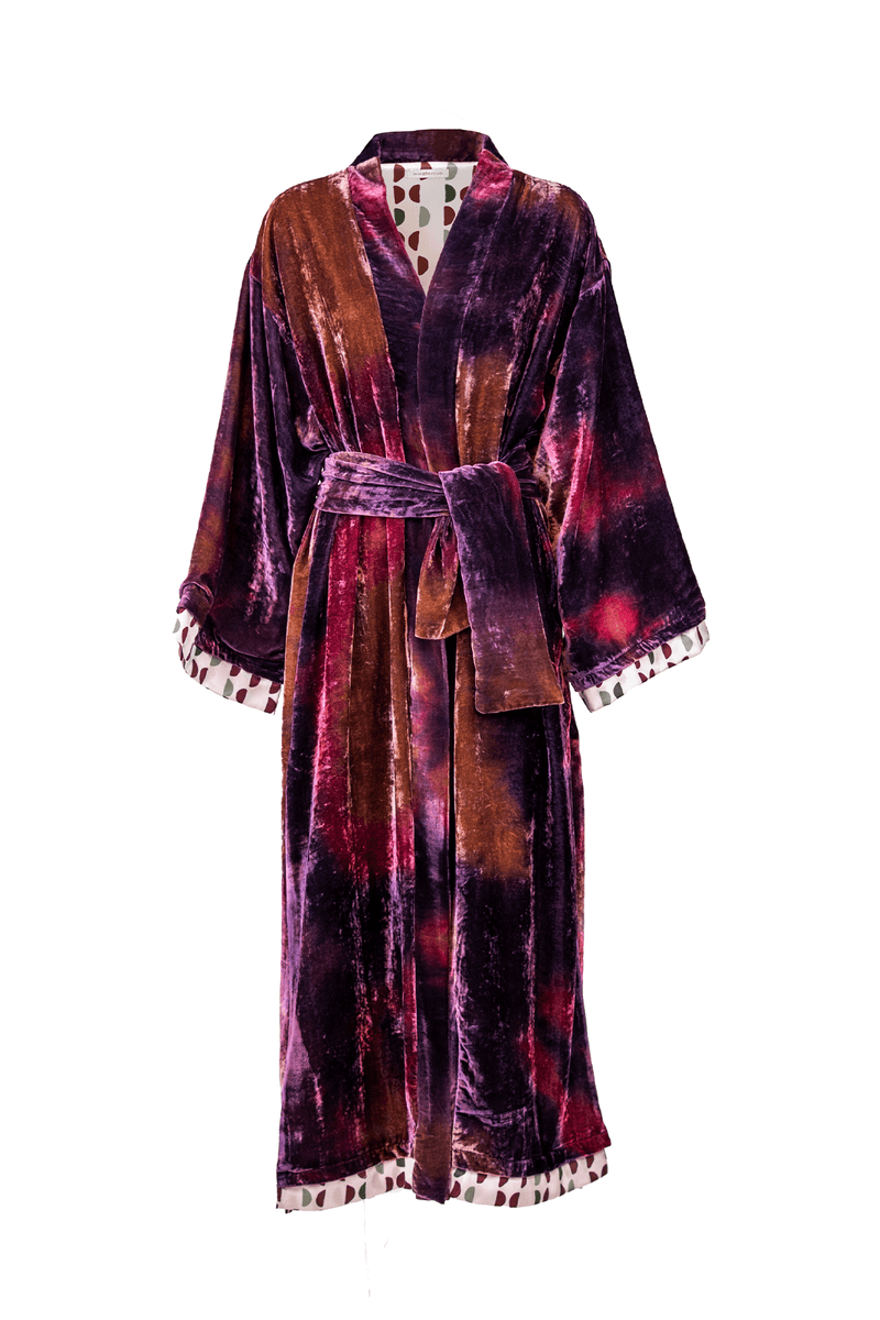 Elegant kimono robe in rich purple and orange velvet with printed lining and tassel details.