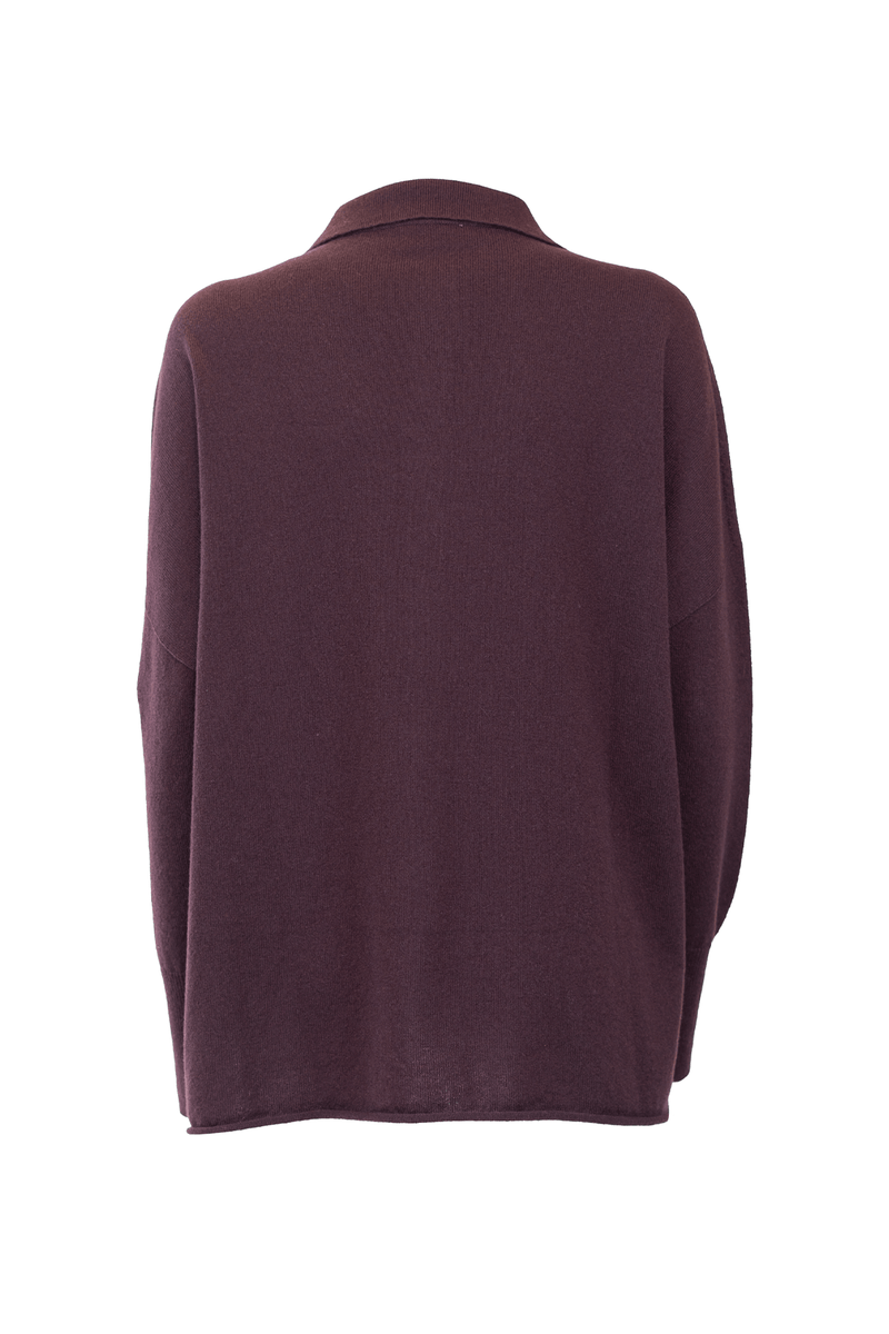 Back view of a luxurious cashmere shirt in deep purple color, showcasing its soft fabric and timeless design.