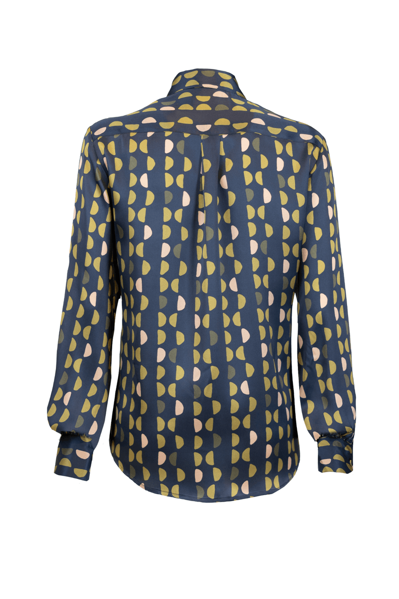 Back view of a feminine silk shirt featuring a geometric print in navy, yellow, and pink tones with a classic collar.